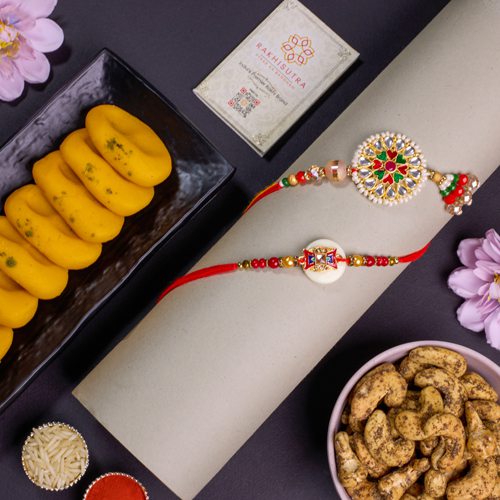 Elegant Rakhi Duo with Assorted Snacks